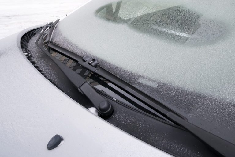 Closeup of cowl panel on gray car.