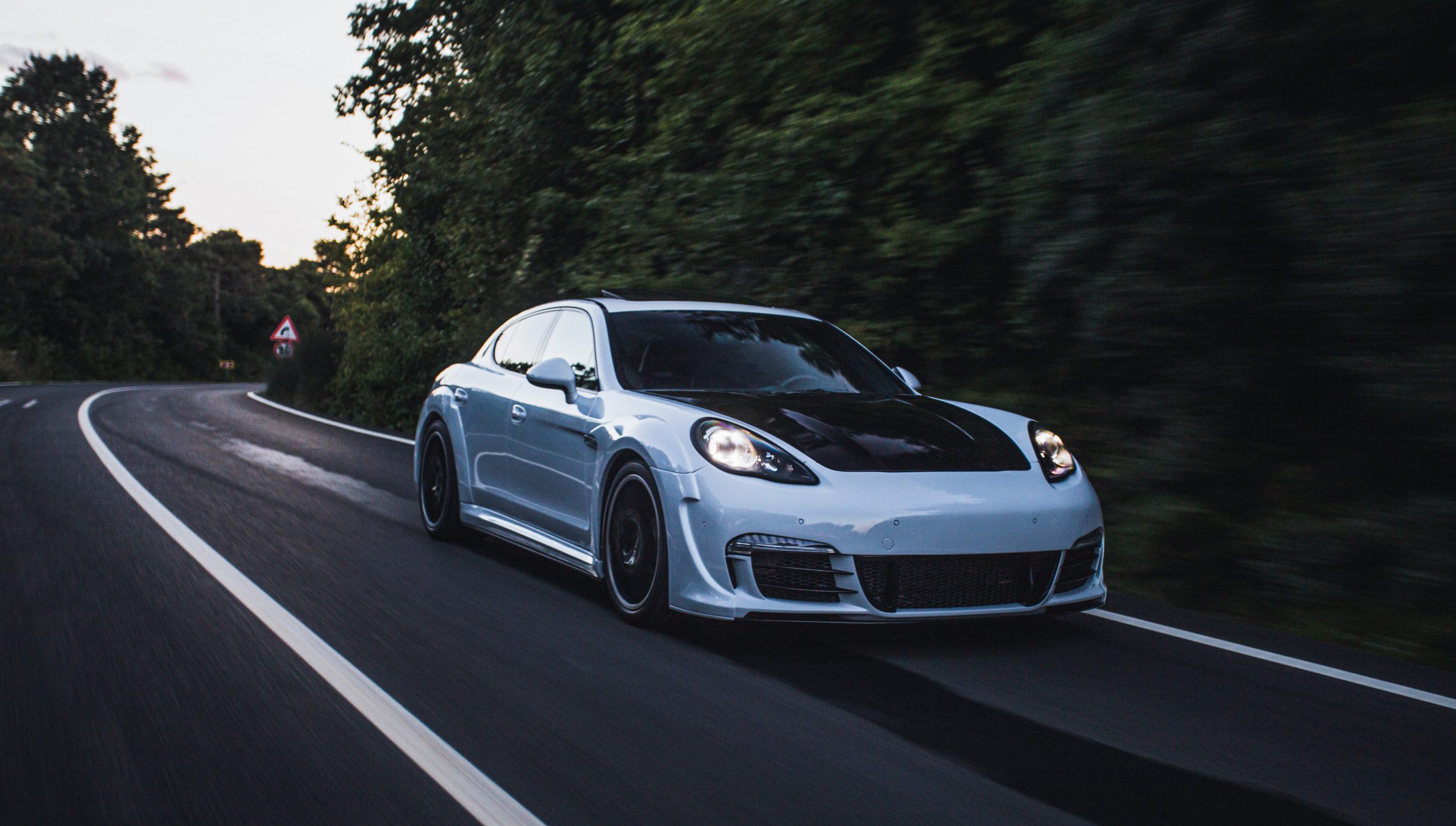 sports-car-azerbaijan_stockers Sports car in highway with trees in the background illustrates blog "What Are the Effects of a Faulty Radiator Support?"