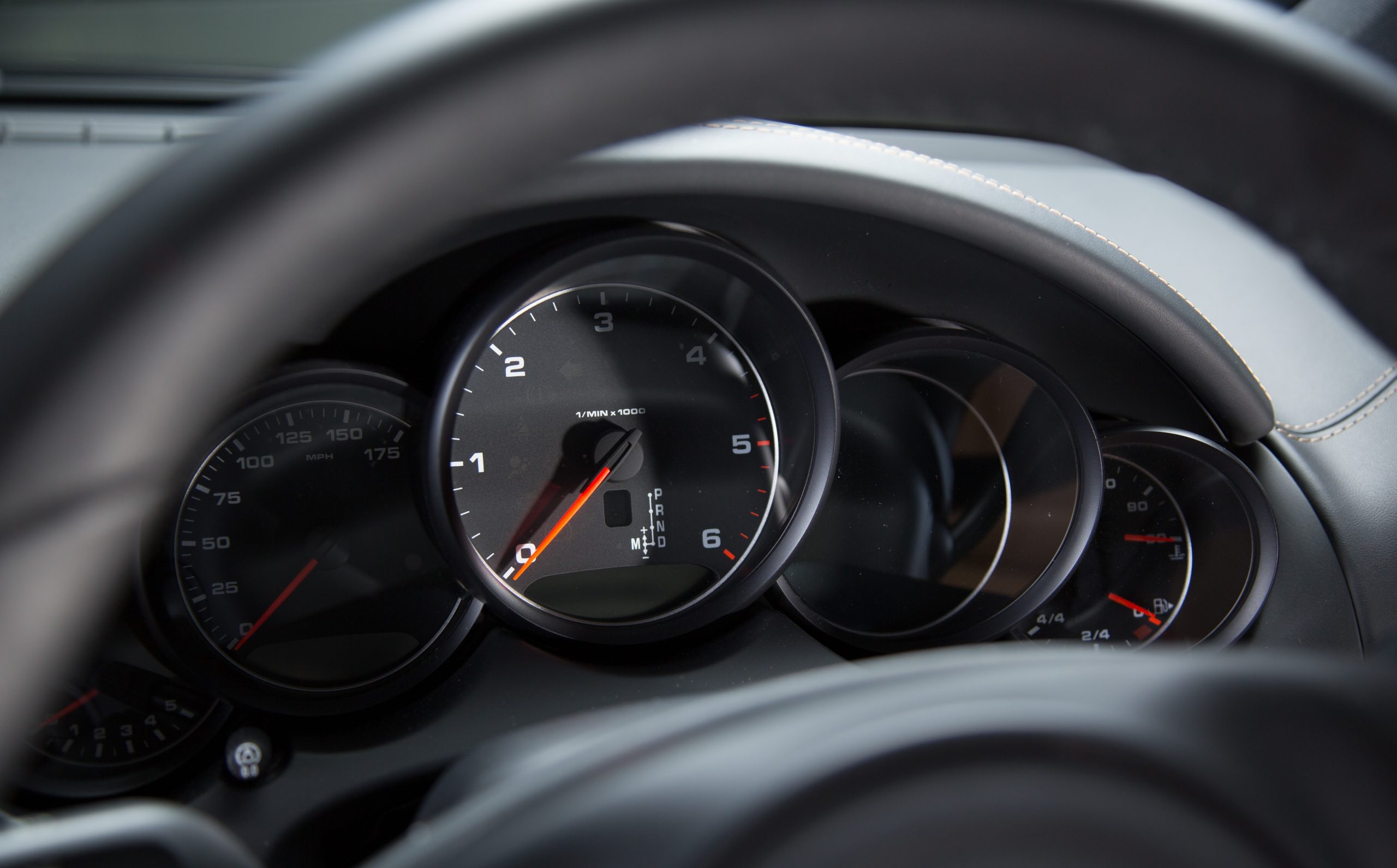 car-dashboard-wirestock Closeeup of car dashboard showing the steering wheel and tachometer illustrates blog "Tips to Keep Your Car Dashboard Looking Like New"