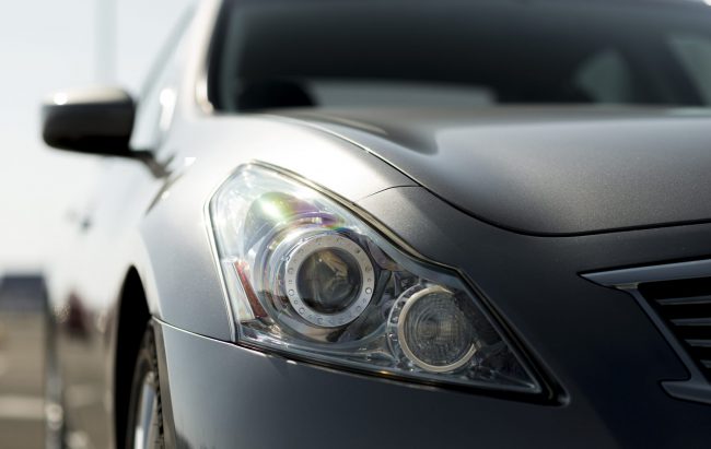 hood-car-fp Closeup of hood of gray car.