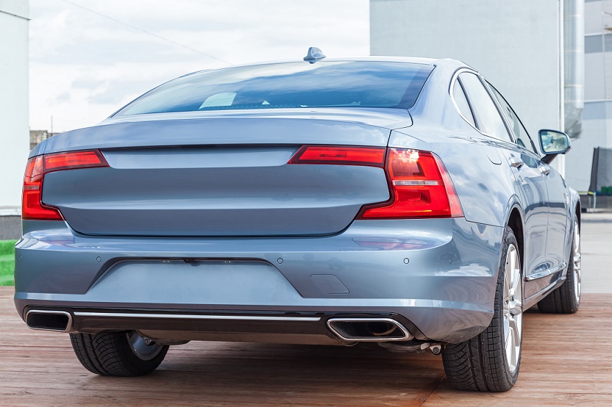 Rear bumper of blue gray car.